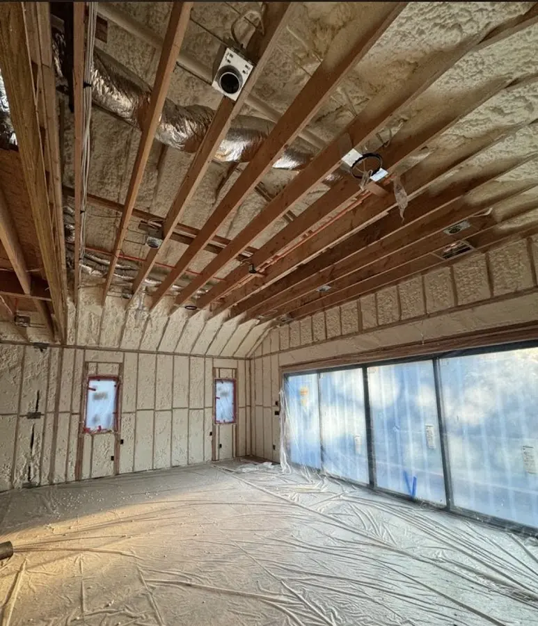 Interior walls and ceiling insulated with spray foam during new construction in Willington